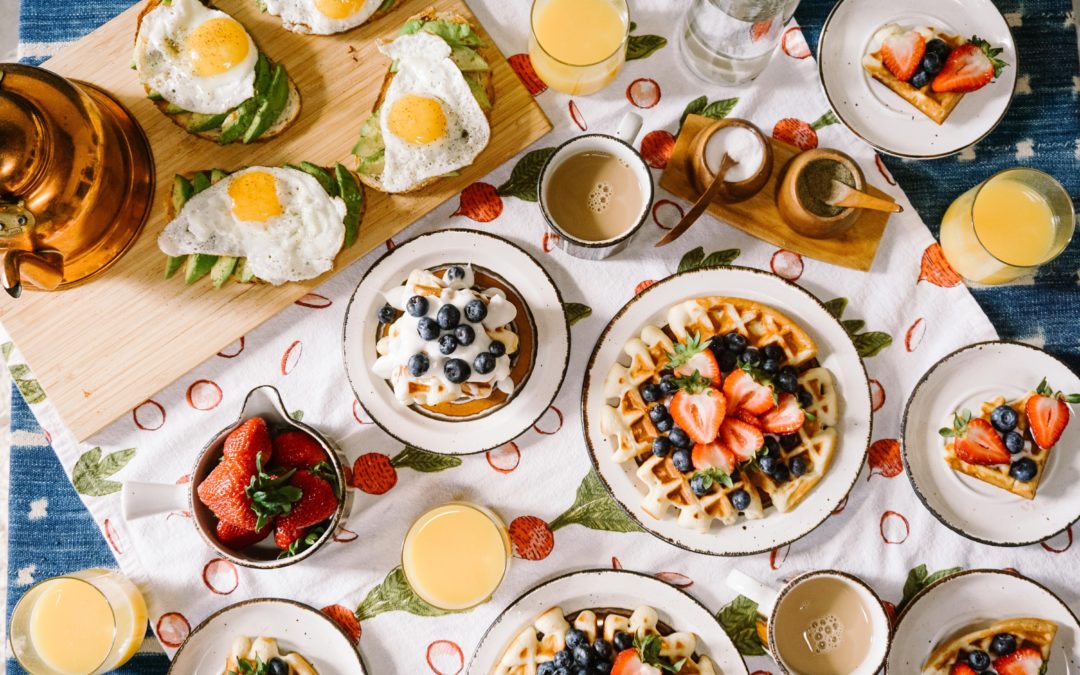 breakfast spread of waffles and eggs