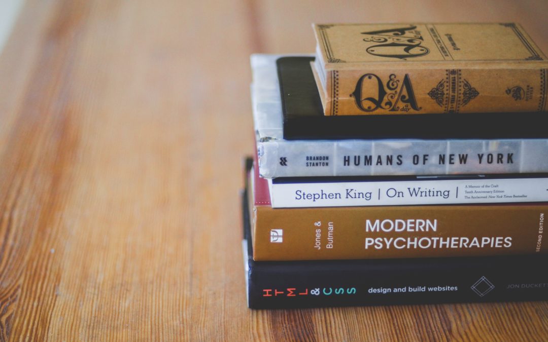 stack of books on wood table